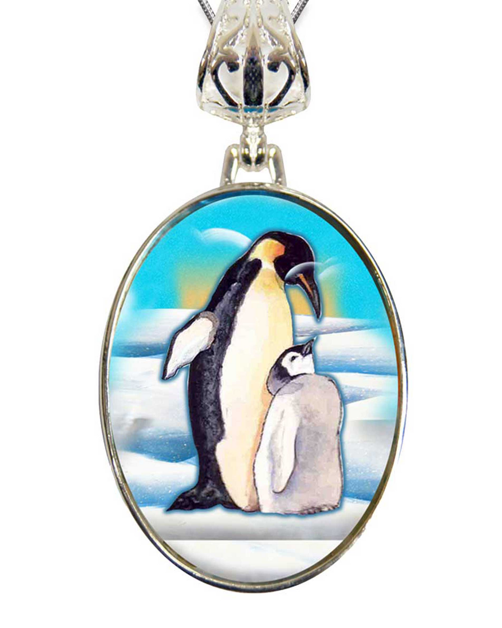 A pendant featuring a painting of two penguins, one larger and one smaller, standing together in a snowy landscape.