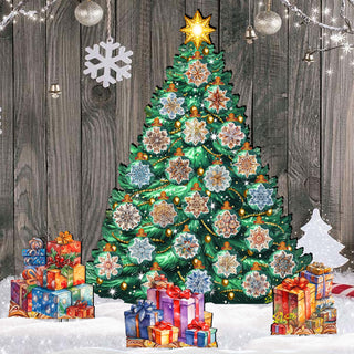A large, colorful Christmas tree adorned with various ornaments stands in a snowy setting, surrounded by a pile of wrapped gifts and a snowman.