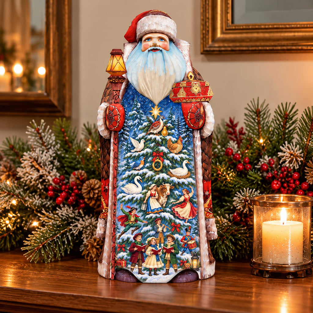A beautifully decorated Christmas ornament, resembling a Santa Claus figure, is displayed on a wooden surface. The ornament is adorned with a detailed winter scene, including a snow-covered tree, reindeer, and other festive elements. The ornament is surrounded by holiday decorations, such as pine branches and berries, creating a festive atmosphere. A lit candle can also be seen in the background, adding to the warm and cozy ambiance of the scene.