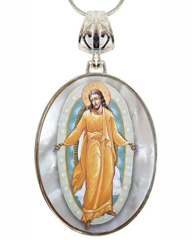 a pendant with a religious icon of Jesus Christ, wearing an orange robe and standing in a halo.