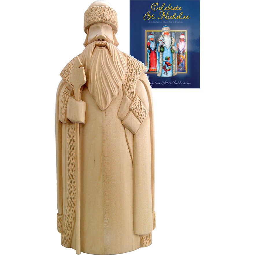 A wooden sculpture of St. Nicholas, a popular Christmas character, is displayed next to a book titled 
