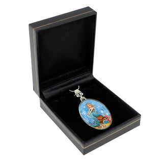 A pendant in a black jewelry box with a mermaid design.