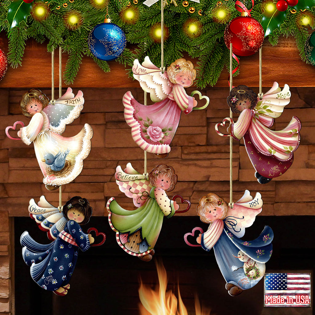 A festive arrangement of colorful angel ornaments hanging above a fireplace, with Christmas lights and greenery visible in the background.
