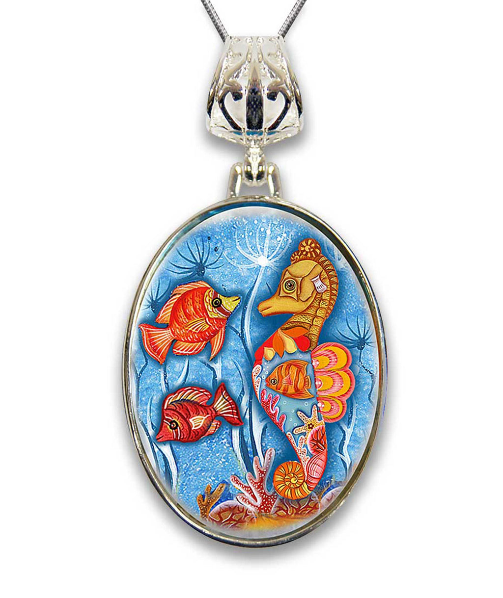 A pendant necklace with a circular design featuring a colorful underwater scene with various marine life, including fish, coral, and a large sea creature.