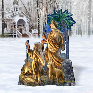 A 3D cutout of a nativity scene depicting a shepherd and his lamb, with a house and trees in the background.