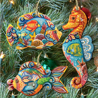 a Christmas tree decorated with colorful ornaments shaped like fish and a seahorse.