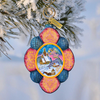 A colorful ornament with a floral design hangs from a tree branch, featuring a snowy landscape and a castle in the background.