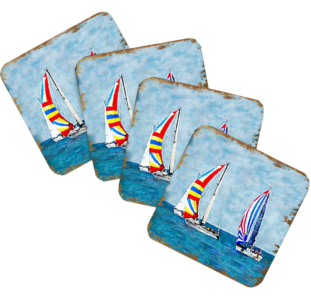 A set of four coasters featuring colorful sailboats on the water.