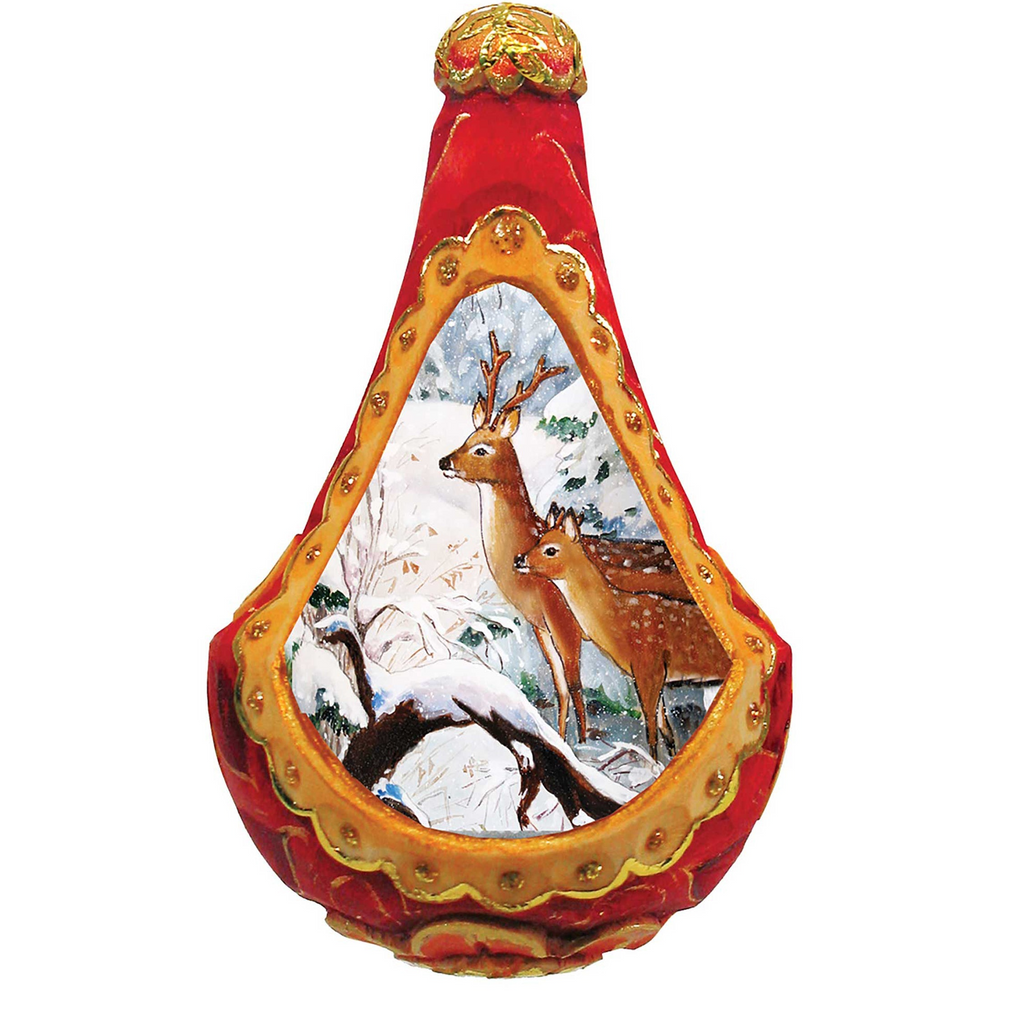 A decorative ornament with a red body and gold trim, featuring a painting of two deer in a snowy landscape.