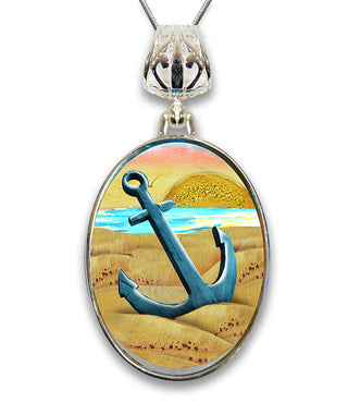 A pendant necklace with a circular design featuring a blue anchor and a sunset landscape.