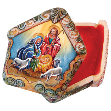 a colorful, intricately designed box with a painted scene of the nativity scene, including the baby Jesus, Mary, and Joseph.