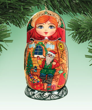 A colorful ornament featuring a doll with a red headdress and a Santa Claus figure, set against a Christmas tree and other holiday-themed elements.