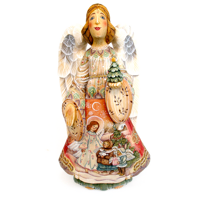 A figurine of an angel holding a Christmas tree and a crescent moon, with intricate details and vibrant colors.
