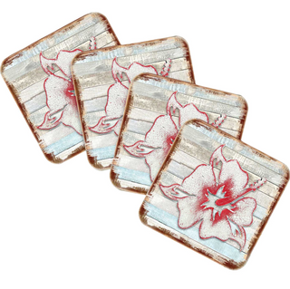 four square coasters with a floral design, featuring a red flower against a light blue background.