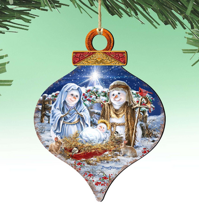 A Christmas ornament depicting the nativity scene with the baby Jesus, Mary, and Joseph, surrounded by snow and animals.