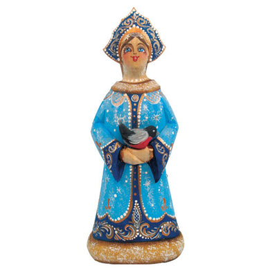 A figurine of a woman wearing a blue dress with gold accents and a blue headdress, holding a bird in her hands.