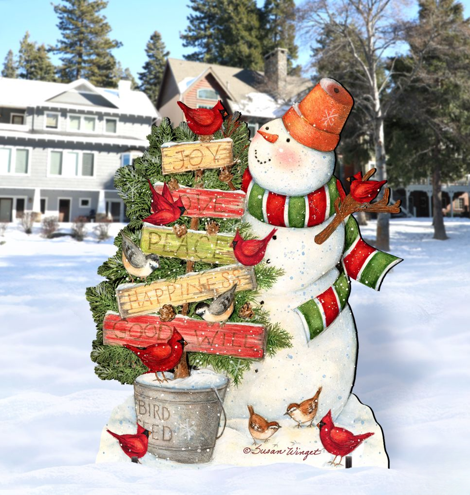 A snowman figure adorned with a sign that says 