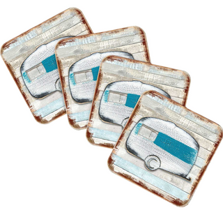 four square coasters with a vintage-style illustration of a camper van on them.