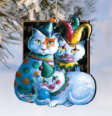 A whimsical ornament featuring three cats dressed in colorful clown hats and costumes, with one cat sitting on top of another.