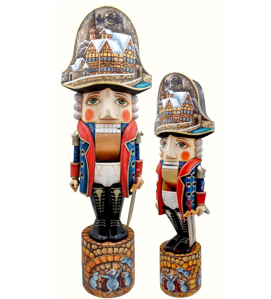 Two nutcracker figurines, one larger and one smaller, both wearing colorful outfits and hats with intricate designs.
