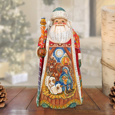 A colorful, handcrafted wooden Santa Claus figurine with intricate details and a detailed design, standing on a wooden surface.
