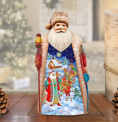 A wooden Santa Claus figurine with a detailed winter scene painted on its body, standing on a wooden surface.