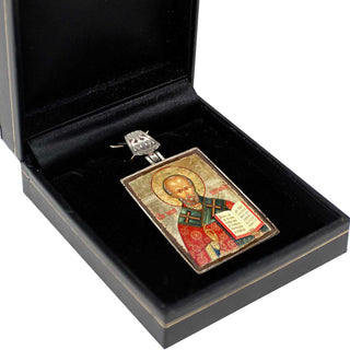a religious icon, possibly a religious figure, displayed in a black box.