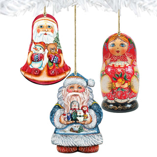 three colorful ornaments hanging from a string, including a Santa Claus figure, a Russian nesting doll, and a snowman.