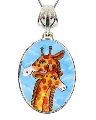 A pendant necklace with a circular design featuring two giraffes with orange and brown spots against a blue sky background.