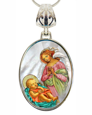 a pendant with a painting of a baby in a crib and an angel, both depicted in a religious style.
