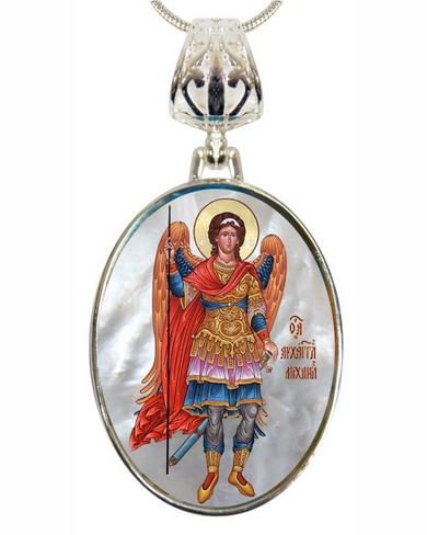 a pendant with a depiction of a saint or religious figure, wearing ornate robes and holding a staff.