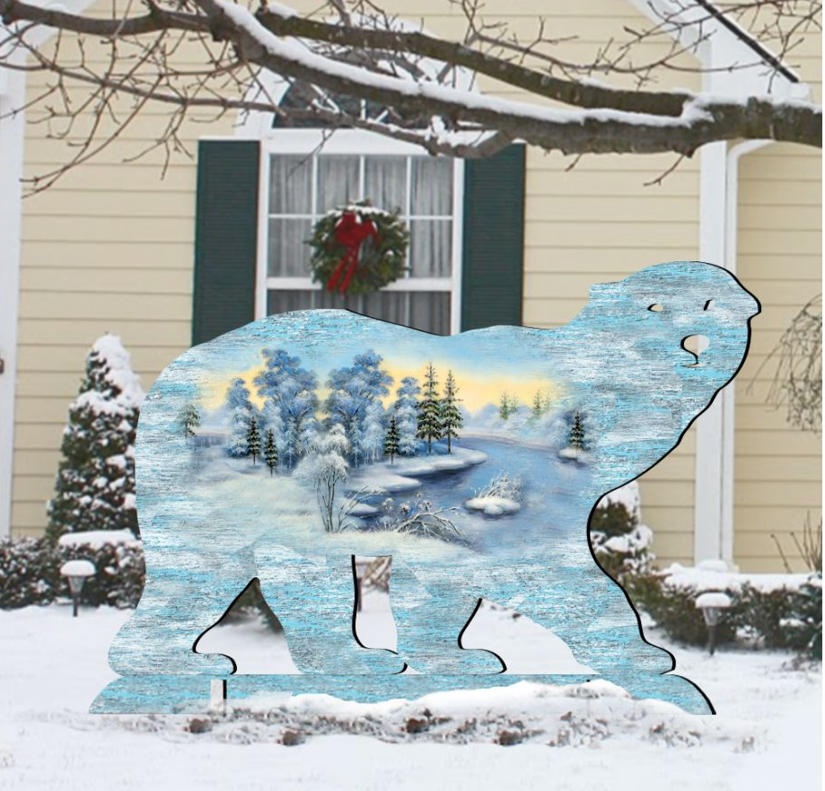 A polar bear silhouette is displayed in front of a house with a wreath on the window, surrounded by snow-covered trees and bushes.