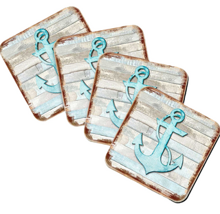 four square coasters with a nautical design featuring a blue anchor on a wooden background.