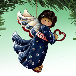 A hand-painted ornament of an angel with a heart-shaped heart in its hand, wearing a blue dress with white flowers.