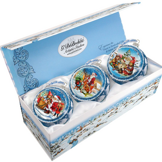 A set of three Christmas ornaments in a blue box, each featuring a different scene with Santa Claus and other holiday characters.