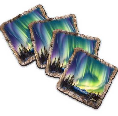 a collection of four square coasters with a captivating image of the Aurora Borealis, or Northern Lights, illuminating the night sky.