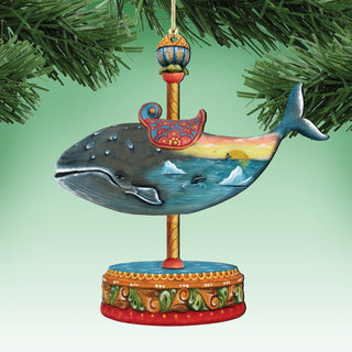 A colorful ornament depicting a painted whale on a carousel base, hanging on a tree branch.