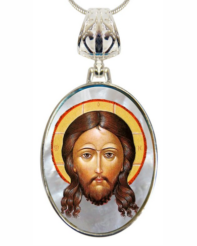 a pendant with a depiction of Jesus Christ's face.