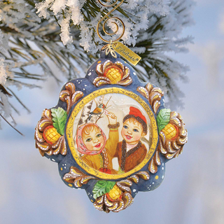 A decorative ornament hanging from a tree branch, featuring a painting of two children.