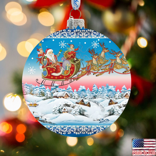 A Christmas ornament featuring Santa Claus and reindeer flying over a snowy village landscape.