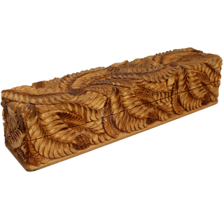 A wooden box with a carved design on its surface, featuring a repeating pattern of leaves or branches.