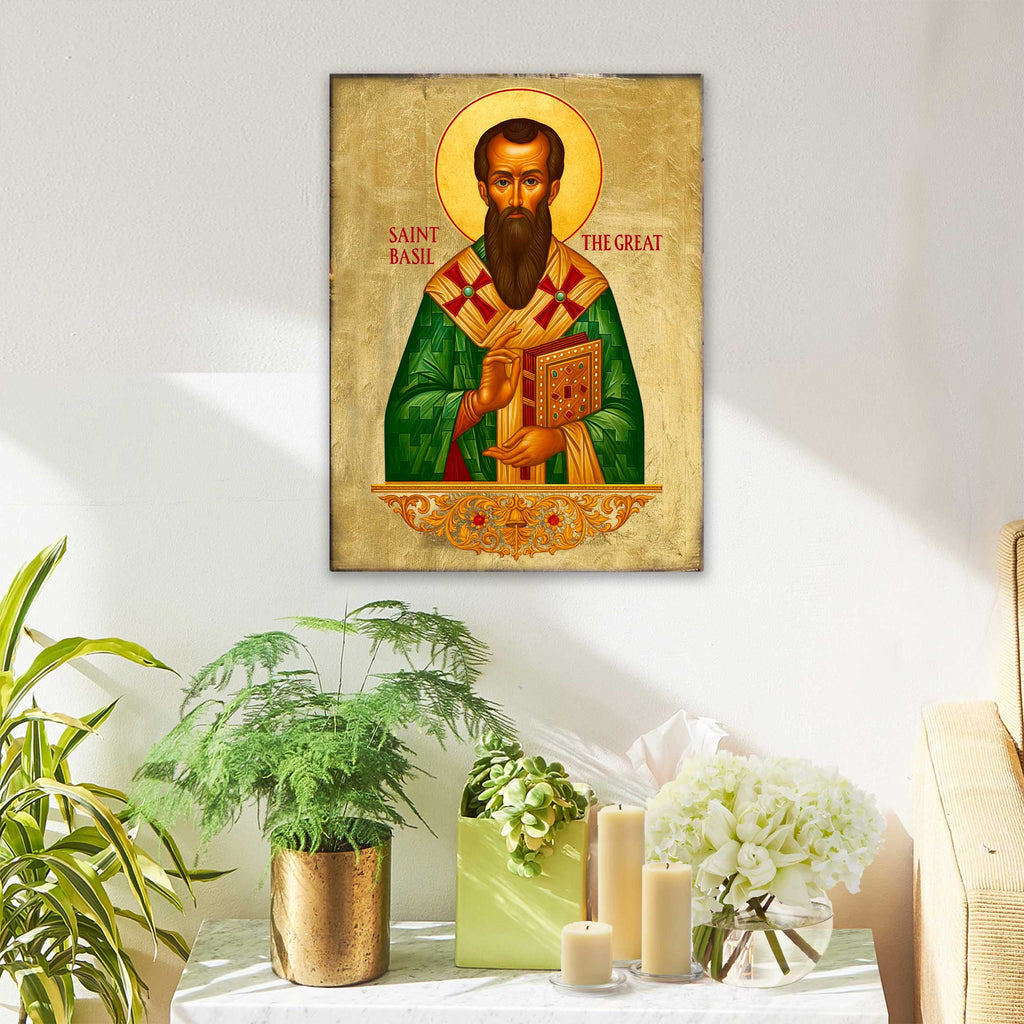 a framed illustration of Saint Basil, a famous Russian Orthodox saint, hanging on a wall above a table with potted plants and candles.