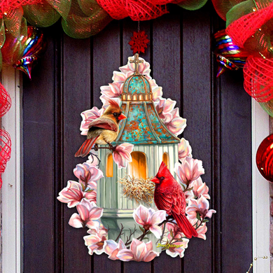 A birdhouse with two birds perched on it, surrounded by pink flowers and a red cardinal.