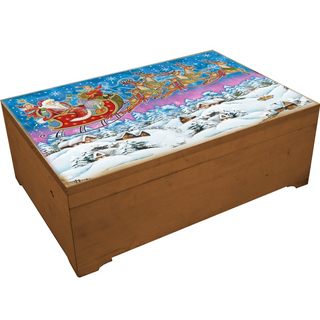 A wooden box with a painted illustration of Santa Claus and reindeer on a sleigh, set against a snowy winter landscape.