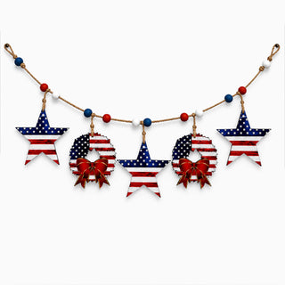 A string of decorative American flag-themed ornaments, including stars and wreaths, suspended from a string.