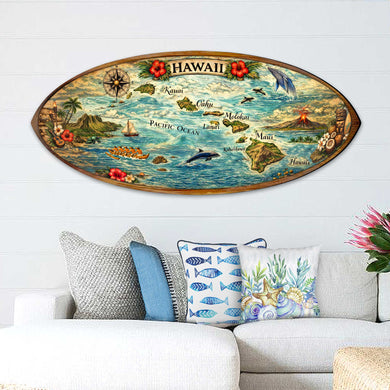 a large, colorful surfboard-shaped map of Hawaii hanging on a wall above a couch with decorative pillows.