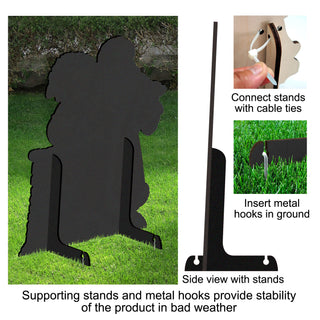 The image is a collage of three photos. The first photo shows a black silhouette of a dog sitting on a lawn, with a person's hand visible in the top right corner. The second photo provides a side view of the product, highlighting the metal hooks and cable ties that can be connected to the stands. The third photo shows a close-up view of the product, focusing on the metal hooks and cable ties.