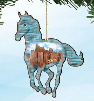 A decorative ornament in the shape of a horse, with a desert landscape visible through the horse's body.