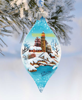 a glass ornament hanging from a christmas tree