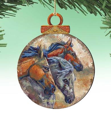 A round ornament featuring a painting of three horses, with a wooden frame and a decorative top.